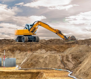 Wir sind Aussteller auf der 21. Erdbaufachtagung Leipzig. Auf dem Bild sieht man einen großen Bagger bei Baggerarbeiten